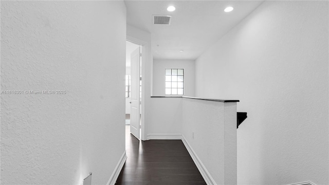 11530 SW 13th Ct, Pembroke Pines, FL 33025 - hallway with baseboards, dark wood-type flooring, a textured wall, recessed lighting, and an upstairs landing