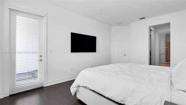 11530 SW 13th Ct, Pembroke Pines, FL 33025 - bedroom with dark wood-style floors, baseboards, and access to exterior
