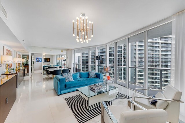 495 Brickell Ave Unit 3604, Miami, FL 33131 - living area featuring plenty of natural light, expansive windows, light tile patterned floors, and a chandelier