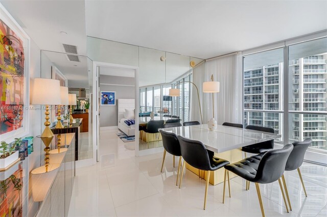 495 Brickell Ave Unit 3604, Miami, FL 33131 - dining room with expansive windows and light tile patterned floors