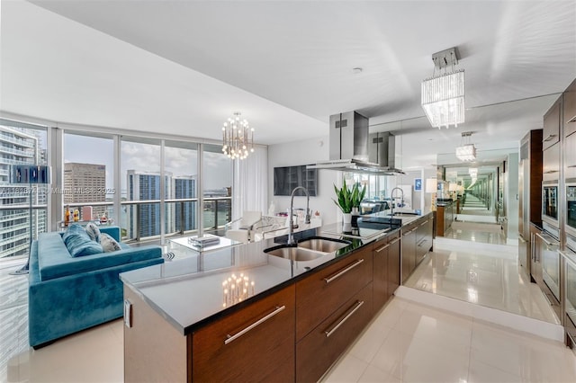 495 Brickell Ave Unit 3604, Miami, FL 33131 - kitchen with modern cabinets, a sink, and a chandelier