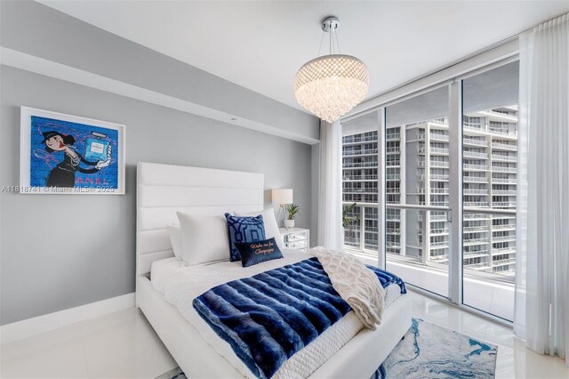 495 Brickell Ave Unit 3604, Miami, FL 33131 - bedroom with a chandelier
