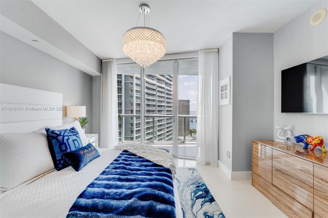 495 Brickell Ave Unit 3604, Miami, FL 33131 - tiled bedroom with multiple windows, floor to ceiling windows, a chandelier, and baseboards