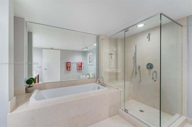 495 Brickell Ave Unit 3604, Miami, FL 33131 - full bathroom with a garden tub, a stall shower, and recessed lighting