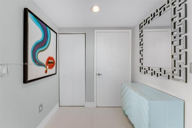 495 Brickell Ave Unit 3604, Miami, FL 33131 - corridor featuring baseboards, recessed lighting, and light tile patterned floors
