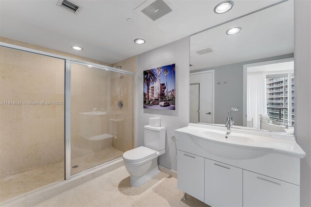 495 Brickell Ave Unit 3604, Miami, FL 33131 - full bathroom featuring toilet, vanity, a stall shower, recessed lighting, and tile patterned flooring