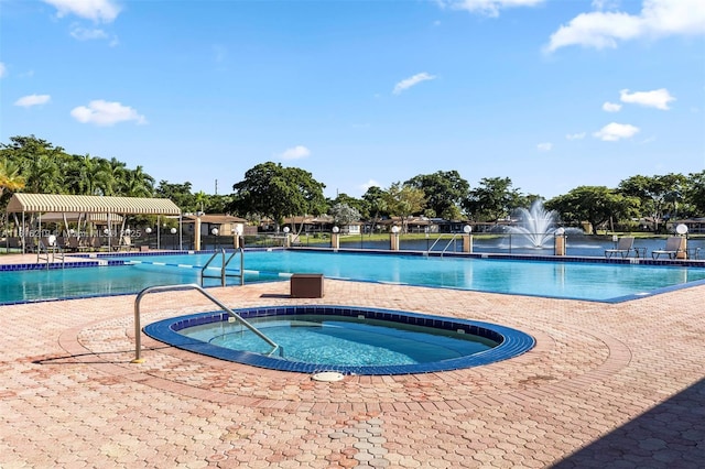 301 Cambridge Rd Unit 302, Hollywood, FL 33024 - community pool with a hot tub and a patio