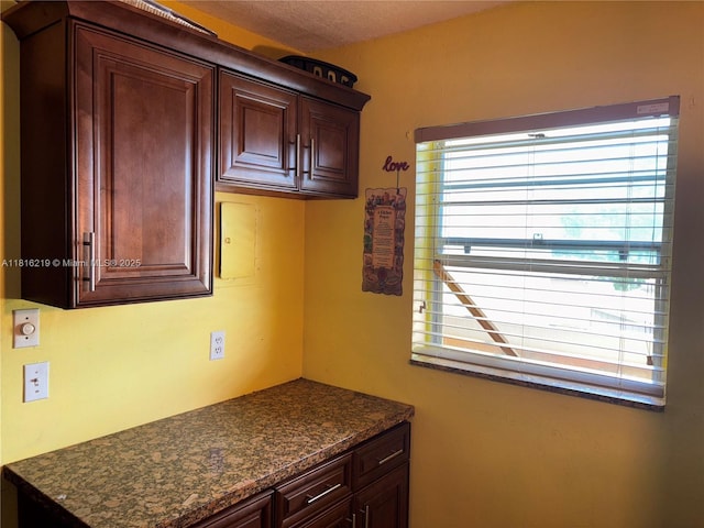 301 Cambridge Rd Unit 302, Hollywood, FL 33024 - kitchen featuring dark countertops and dark brown cabinets