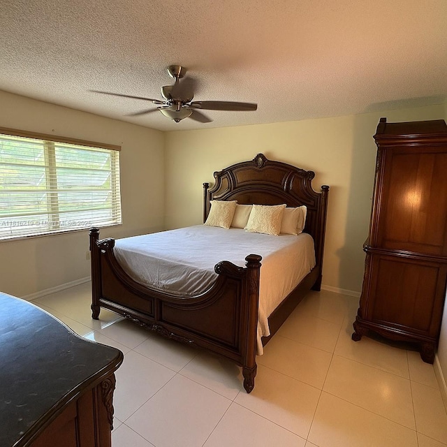 301 Cambridge Rd Unit 302, Hollywood, FL 33024 - bedroom featuring light tile patterned floors, a ceiling fan, and a textured ceiling