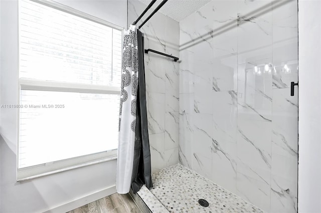 2273 SW Phyllis Ln, Port St Lucie, FL 34953 - bathroom with a marble finish shower and wood finished floors