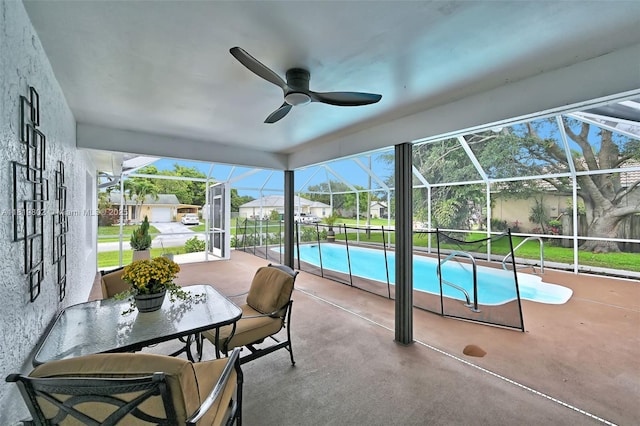 2273 SW Phyllis Ln, Port St Lucie, FL 34953 - outdoor pool with a patio area, ceiling fan, glass enclosure, and a residential view