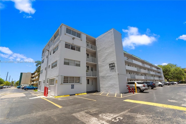 1333 E Hallandale Beach Blvd Unit 421, Hallandale Beach, FL 33009 - view of apartment building / complex featuring uncovered parking