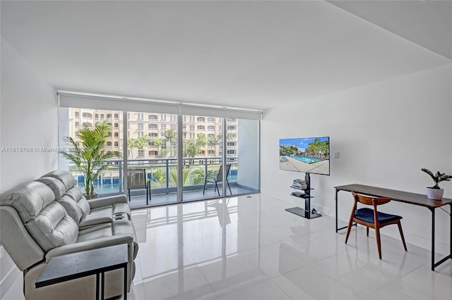 2950 NE 188th St Unit 225, Aventura, FL 33180 - tiled living area with a wall of windows and baseboards