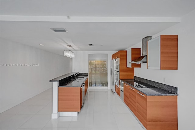 2950 NE 188th St Unit 225, Aventura, FL 33180 - kitchen featuring modern cabinets, a sink, oven, brown cabinets, and dark stone counters