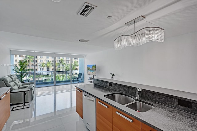 2950 NE 188th St Unit 225, Aventura, FL 33180 - kitchen with a sink, open floor plan, dishwasher, a chandelier, and light tile patterned flooring