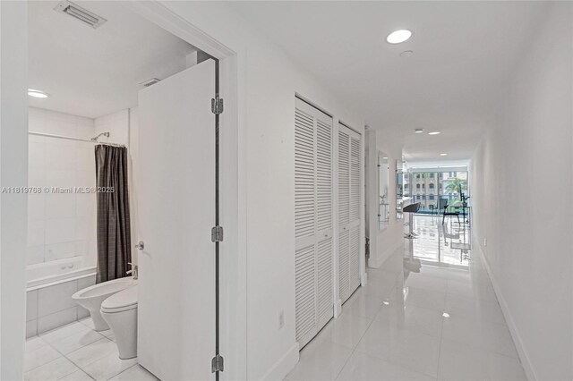 2950 NE 188th St Unit 225, Aventura, FL 33180 - hallway featuring recessed lighting and light tile patterned flooring