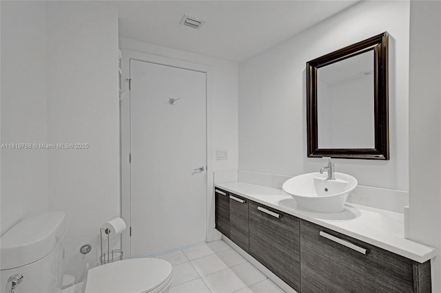 2950 NE 188th St Unit 225, Aventura, FL 33180 - bathroom featuring vanity, toilet, and tile patterned flooring