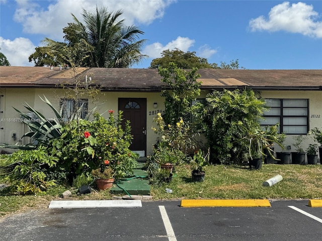 14266 SW 283rd St, Homestead, FL 33033 - view of front of property with uncovered parking, stucco siding, and a shingled roof