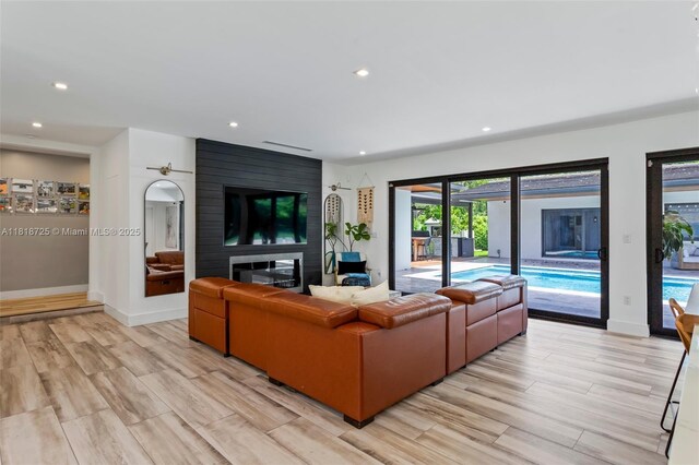 7570 SW 60th St, Miami, FL 33143 - living area with recessed lighting, baseboards, and light wood-type flooring