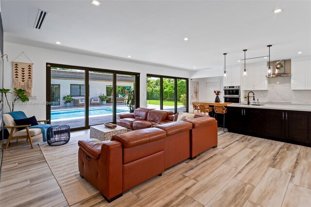 7570 SW 60th St, Miami, FL 33143 - living room featuring recessed lighting and light wood-type flooring