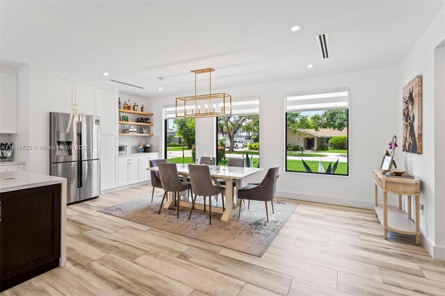 7570 SW 60th St, Miami, FL 33143 - dining area featuring plenty of natural light, light wood-style flooring, recessed lighting, a chandelier, and baseboards
