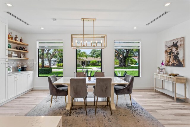 7570 SW 60th St, Miami, FL 33143 - dining area with light wood finished floors, recessed lighting, baseboards, and a chandelier