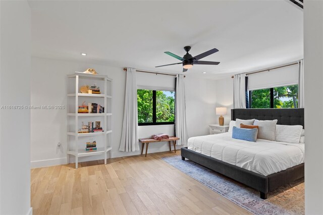 7570 SW 60th St, Miami, FL 33143 - bedroom with wood finished floors, a ceiling fan, and baseboards
