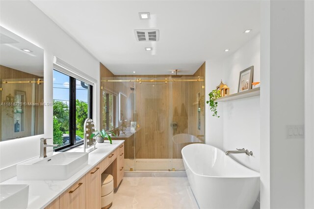 7570 SW 60th St, Miami, FL 33143 - full bathroom featuring a stall shower, double vanity, a soaking tub, and recessed lighting