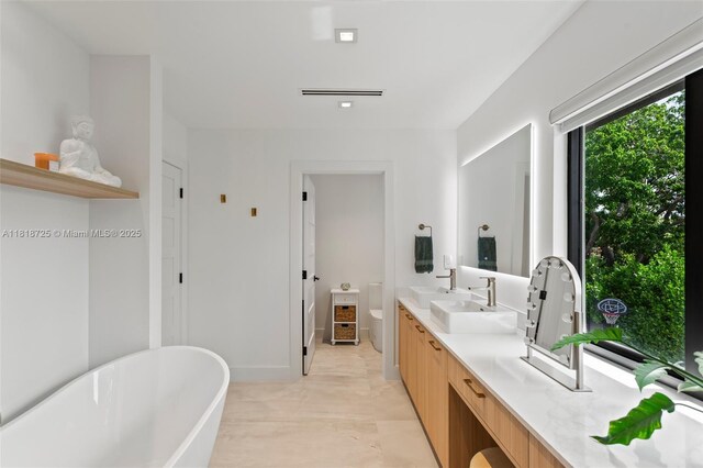 7570 SW 60th St, Miami, FL 33143 - full bath with a freestanding tub, toilet, and double vanity