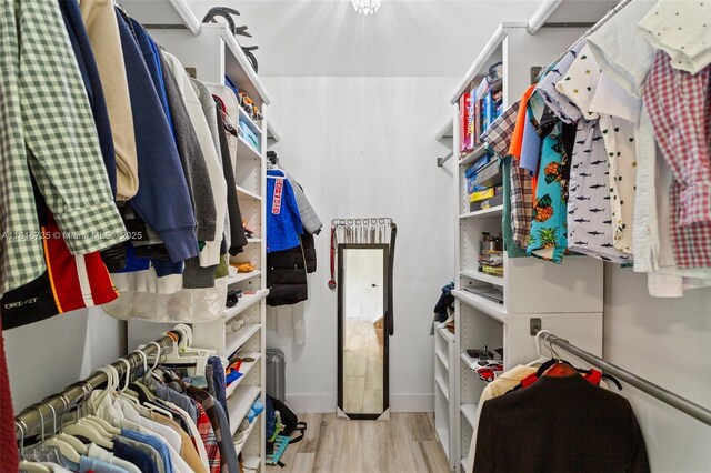 7570 SW 60th St, Miami, FL 33143 - walk in closet featuring wood finished floors