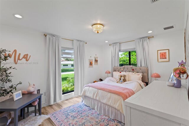 7570 SW 60th St, Miami, FL 33143 - bedroom with light wood-style floors and recessed lighting