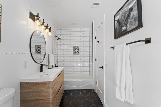 7570 SW 60th St, Miami, FL 33143 - full bath featuring vanity, toilet, tile patterned flooring, and shower / bathtub combination