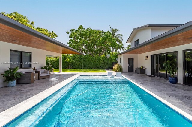 7570 SW 60th St, Miami, FL 33143 - swimming pool featuring a patio area and an outdoor hangout area