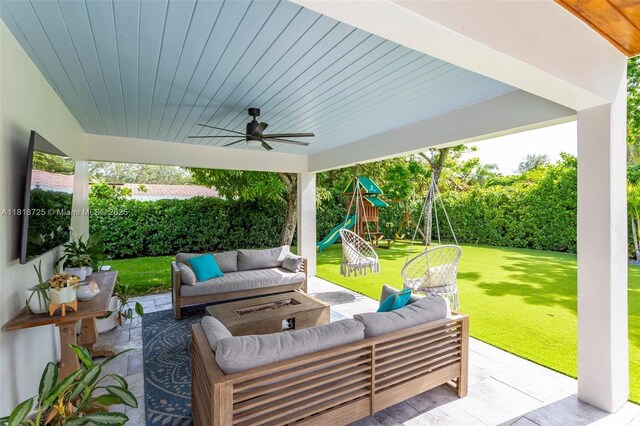 7570 SW 60th St, Miami, FL 33143 - view of patio / terrace with an outdoor hangout area, a ceiling fan, and a playground