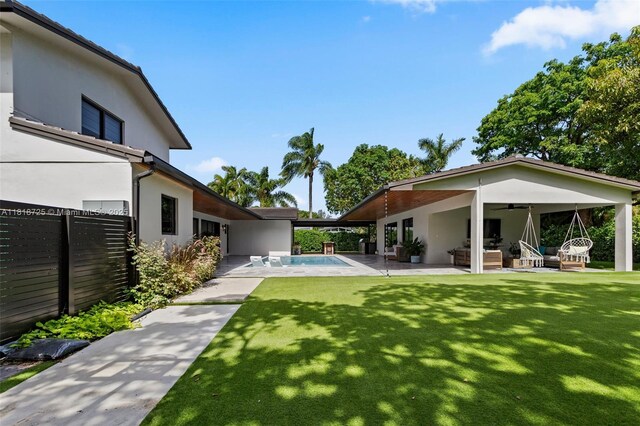 7570 SW 60th St, Miami, FL 33143 - view of yard featuring ceiling fan and a patio area