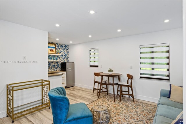 7570 SW 60th St, Miami, FL 33143 - living area featuring light wood-style floors, baseboards, and recessed lighting
