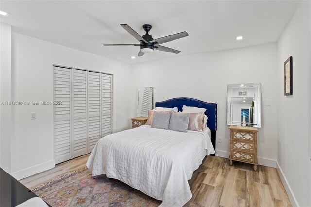 7570 SW 60th St, Miami, FL 33143 - bedroom featuring recessed lighting, wood finished floors, a closet, baseboards, and ceiling fan