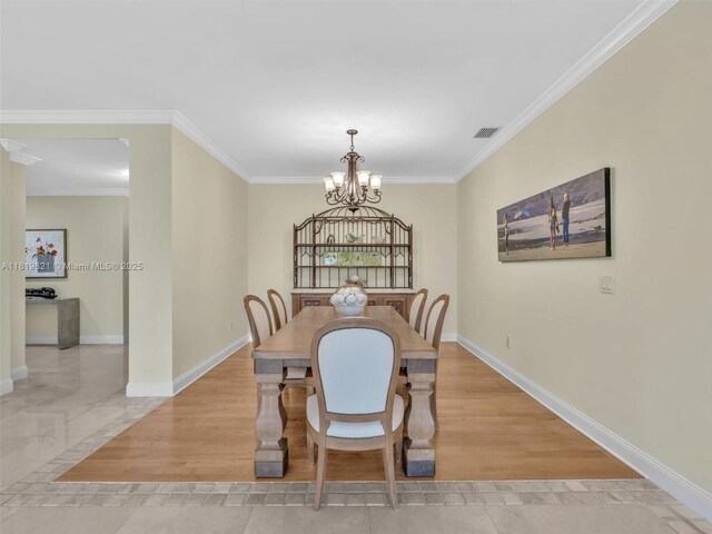 16500 Collins Ave Unit Th-10, Sunny Isles Beach, FL 33160 - dining space featuring a chandelier, crown molding, baseboards, and light tile patterned floors