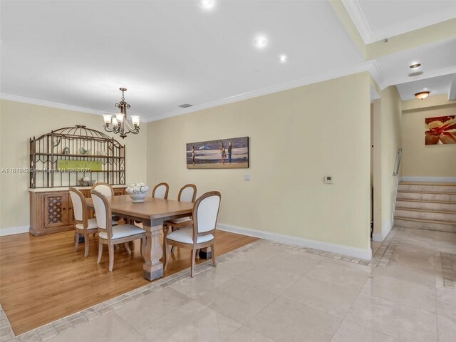 16500 Collins Ave Unit Th-10, Sunny Isles Beach, FL 33160 - dining area with ornamental molding, baseboards, stairway, a chandelier, and light tile patterned flooring