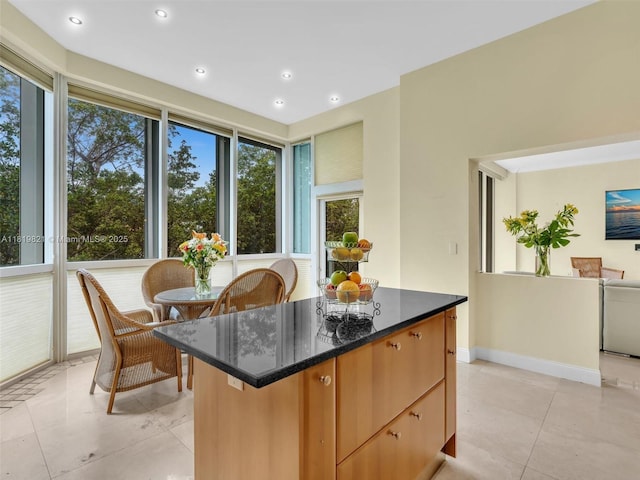 16500 Collins Ave Unit Th-10, Sunny Isles Beach, FL 33160 - kitchen with light tile patterned flooring, a kitchen island, dark stone countertops, recessed lighting, and baseboards