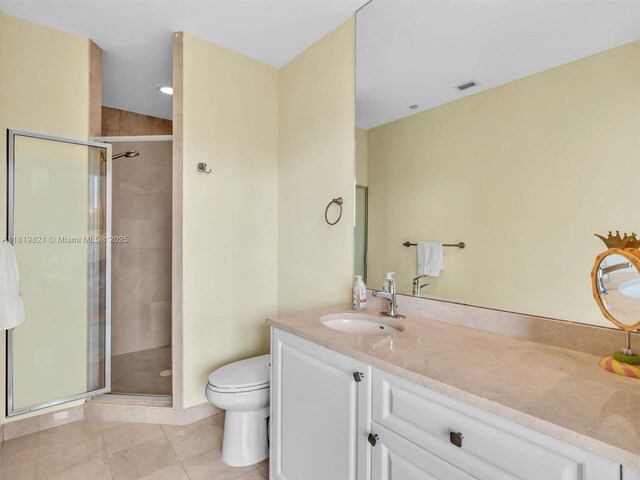 16500 Collins Ave Unit Th-10, Sunny Isles Beach, FL 33160 - bathroom featuring toilet, a shower stall, vanity, and tile patterned flooring