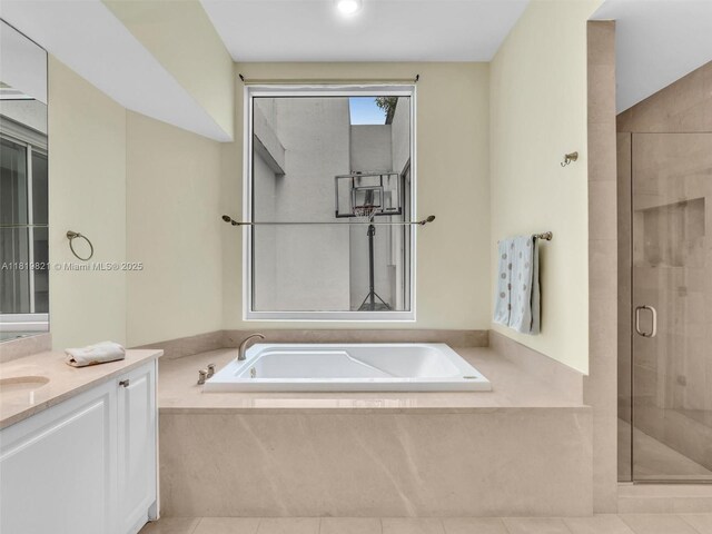 16500 Collins Ave Unit Th-10, Sunny Isles Beach, FL 33160 - bathroom with vanity, a shower stall, a garden tub, and tile patterned floors