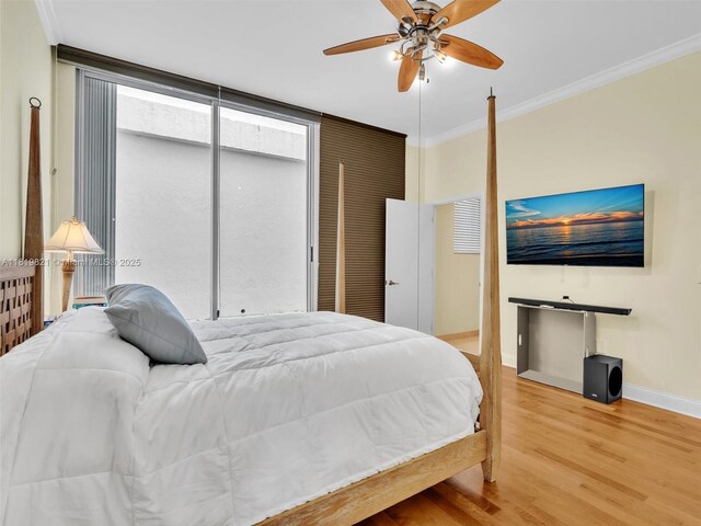 16500 Collins Ave Unit Th-10, Sunny Isles Beach, FL 33160 - bedroom featuring baseboards, wood finished floors, crown molding, and a ceiling fan