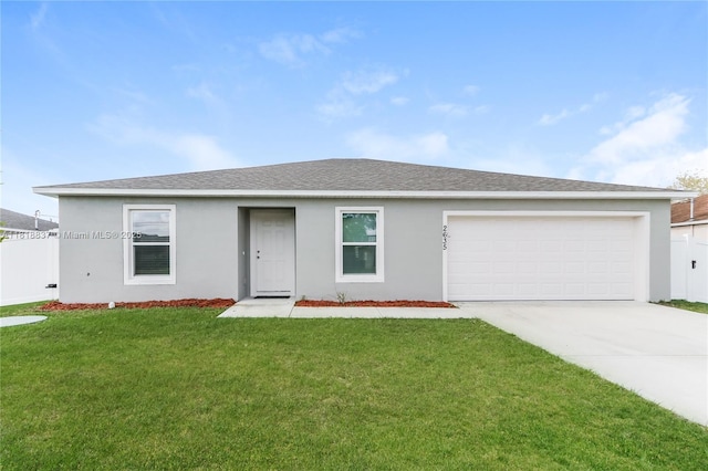 2635 SW Acco Rd, Port St Lucie, FL 34953 - single story home with driveway, stucco siding, an attached garage, and roof with shingles
