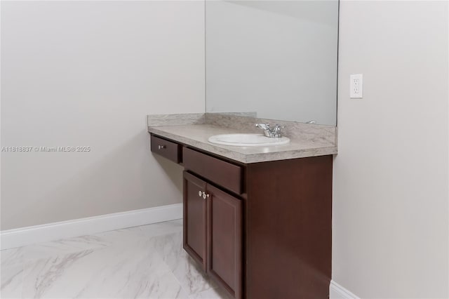 2635 SW Acco Rd, Port St Lucie, FL 34953 - bathroom featuring vanity, baseboards, and marble finish flooring