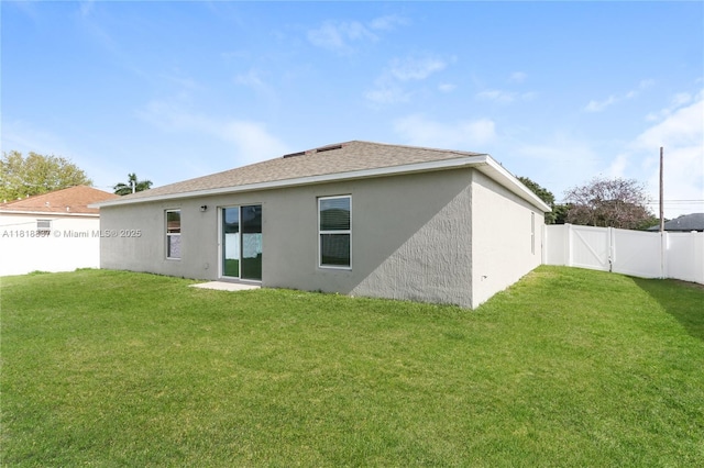 2635 SW Acco Rd, Port St Lucie, FL 34953 - rear view of property featuring stucco siding and roof with shingles