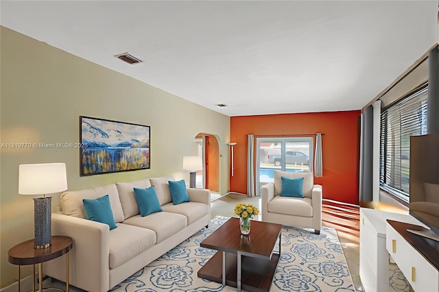 100 NW 23rd Ave, Miami, FL 33125 - living room featuring arched walkways