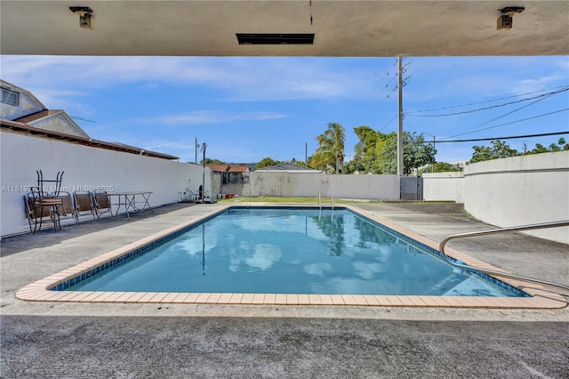 100 NW 23rd Ave, Miami, FL 33125 - view of pool with a fenced backyard and a patio