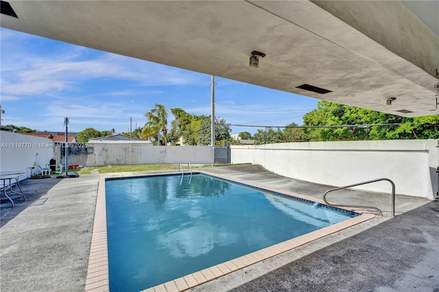 100 NW 23rd Ave, Miami, FL 33125 - view of swimming pool featuring a fenced backyard and a patio area