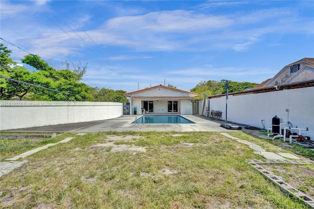 100 NW 23rd Ave, Miami, FL 33125 - back of property featuring a patio area